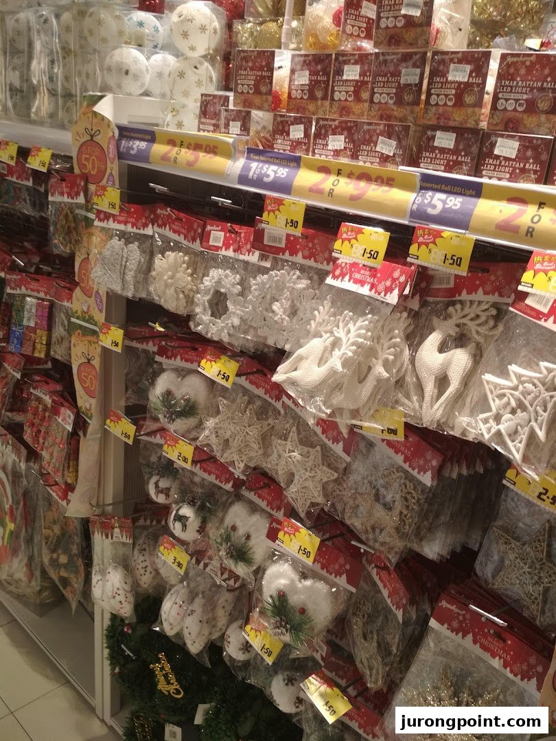 A retail display at Japan Home featuring a variety of Christmas decorations, ornaments, and LED lights.