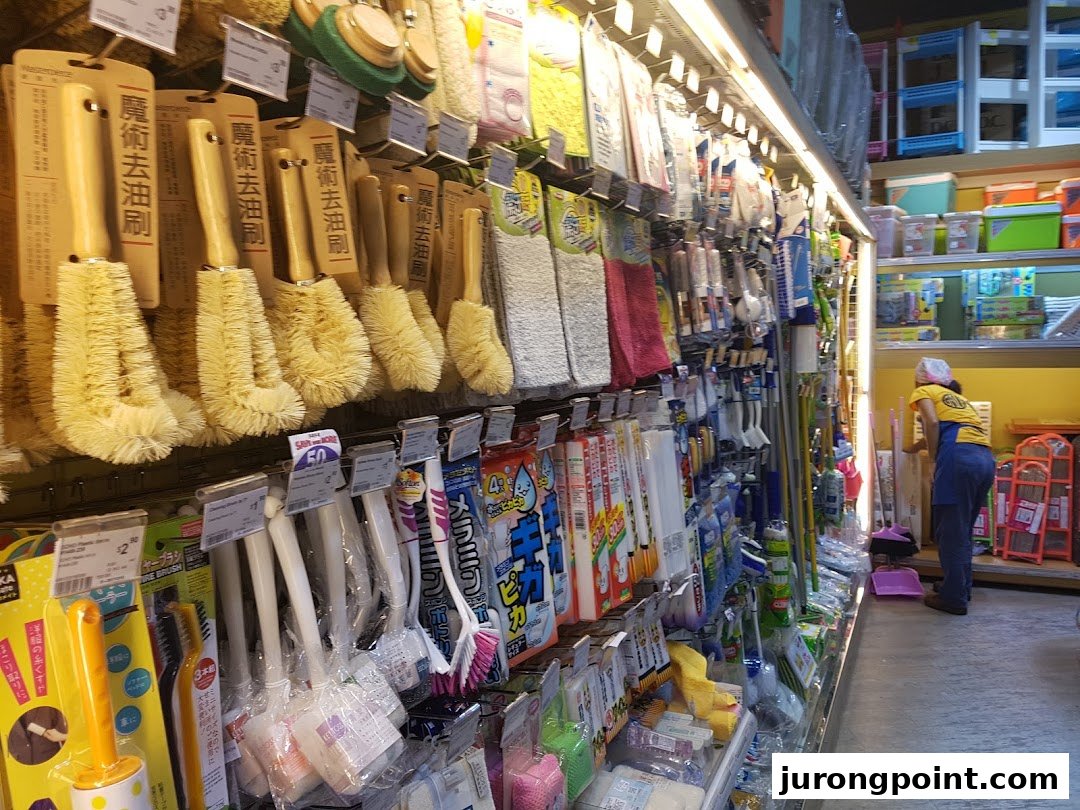 An aisle in Japan Home showcasing a wide array of household cleaning tools and supplies.