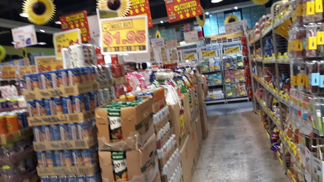 An interior view of Japan Home, showcasing aisles filled with packaged goods and promotional displays.