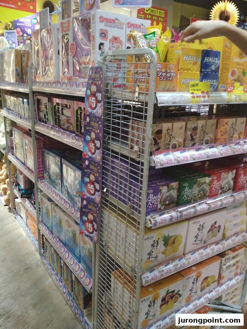 Shelves filled with a diverse range of products, including toys, snacks, and household goods, inside a Japan Home store.