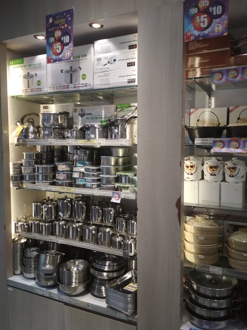 Shelves at Japan Home showcasing a wide array of kitchenware, including pots, pans, and stainless steel containers.