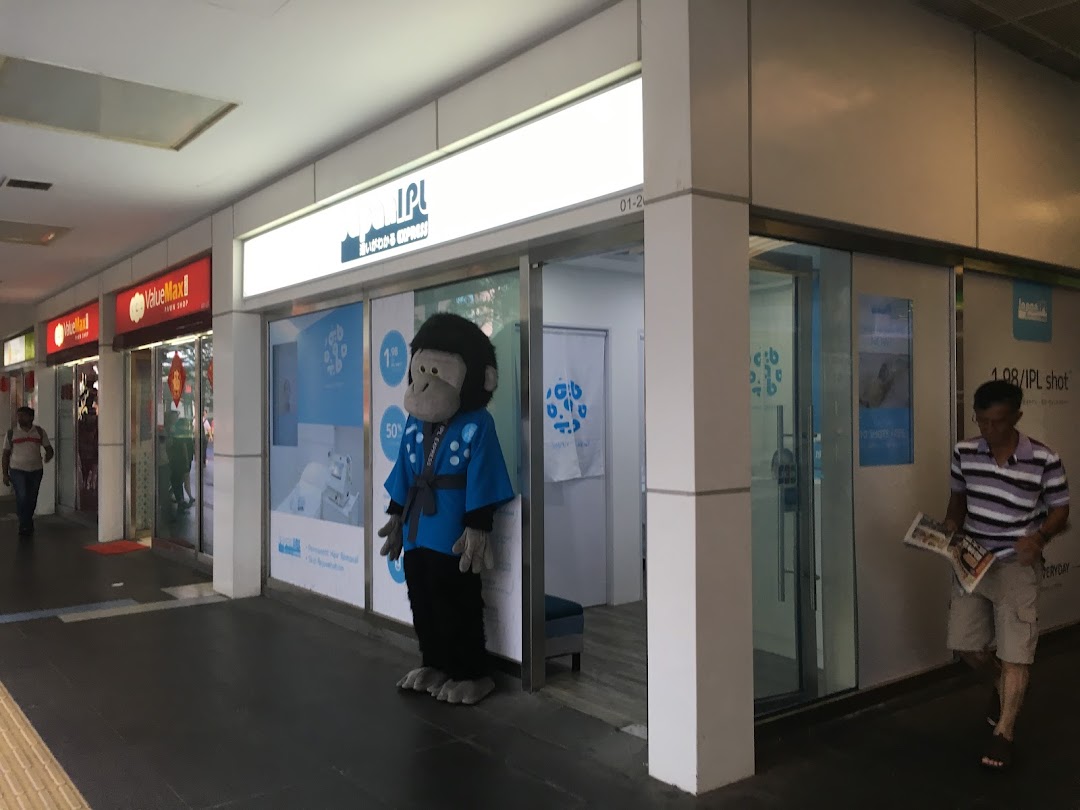 Exterior view of Japan IPL Express shop with a gorilla mascot and prominent signage in a mall corridor.