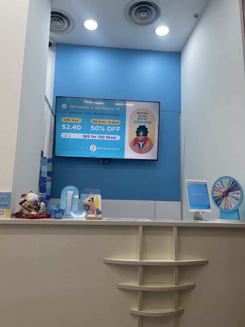 A bright counter area at Japan IPL Express featuring a digital display with IPL treatment promotions.