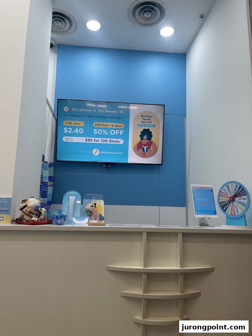 A bright counter area at Japan IPL Express featuring a digital display with IPL treatment promotions.