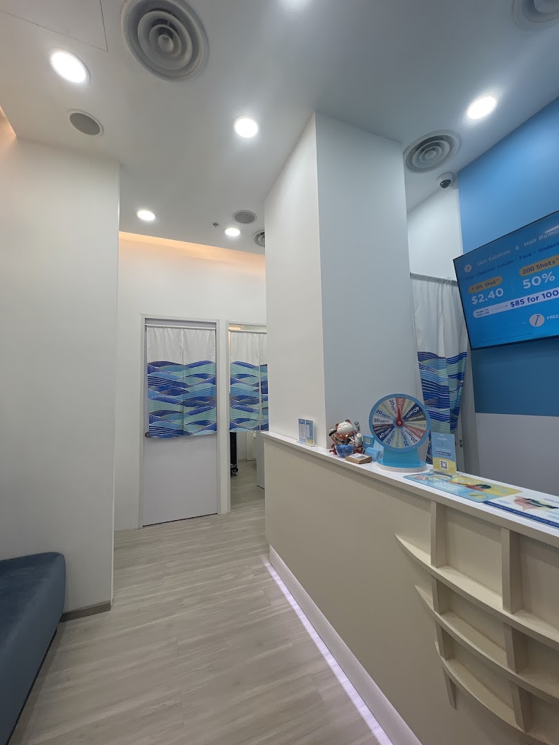 A bright, clean interior view of Japan IPL Express, featuring a reception counter and treatment room entrances.