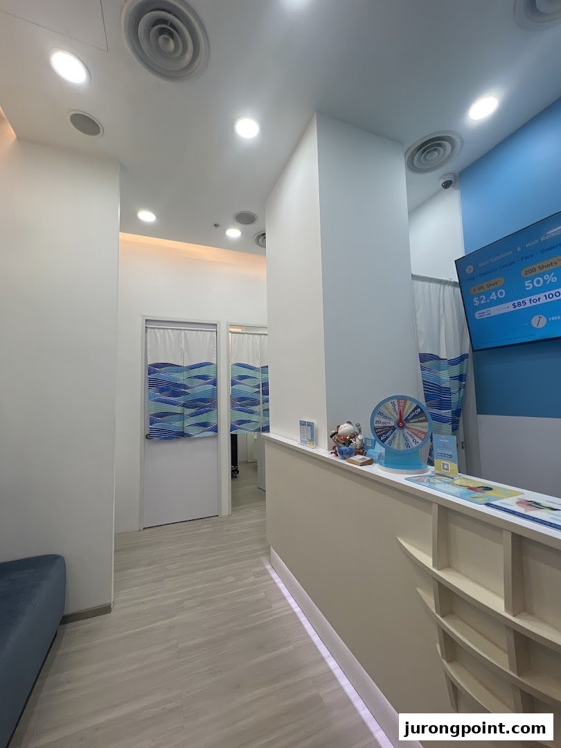 A bright, clean interior view of Japan IPL Express, featuring a reception counter and treatment room entrances.