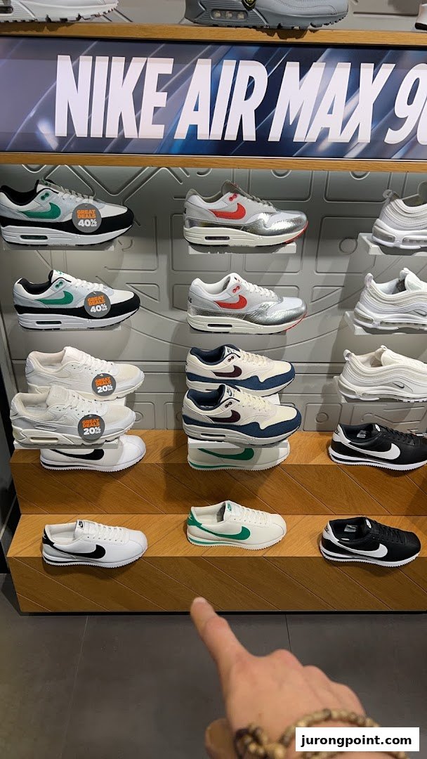 A vibrant display of Nike sneakers, including Air Max models, with some featuring 'Great Deals' discounts.