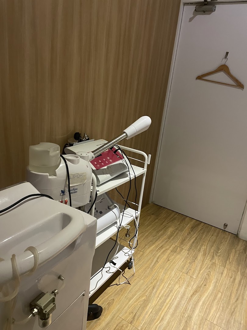 A treatment room at Jean Yip Aesthetics featuring specialized equipment and a clean, modern aesthetic.