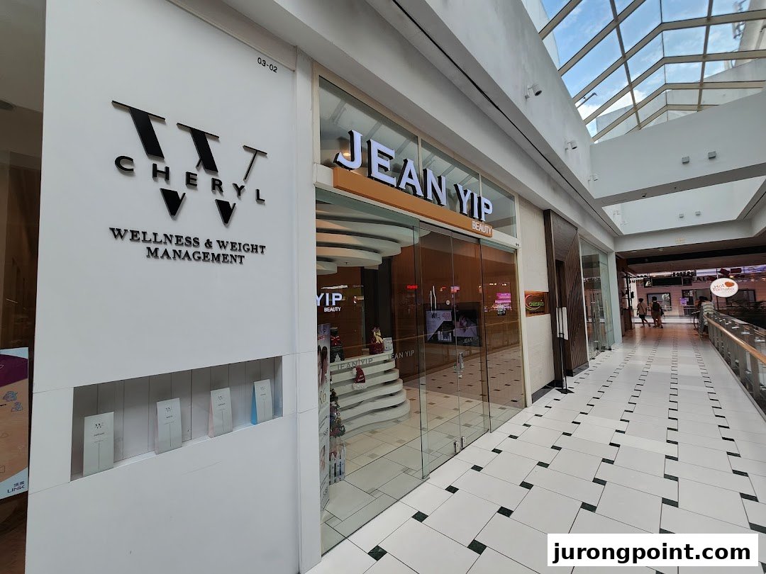 The storefronts of Jean Yip Aesthetics and Cheryl Wellness & Weight Management within a modern shopping mall.
