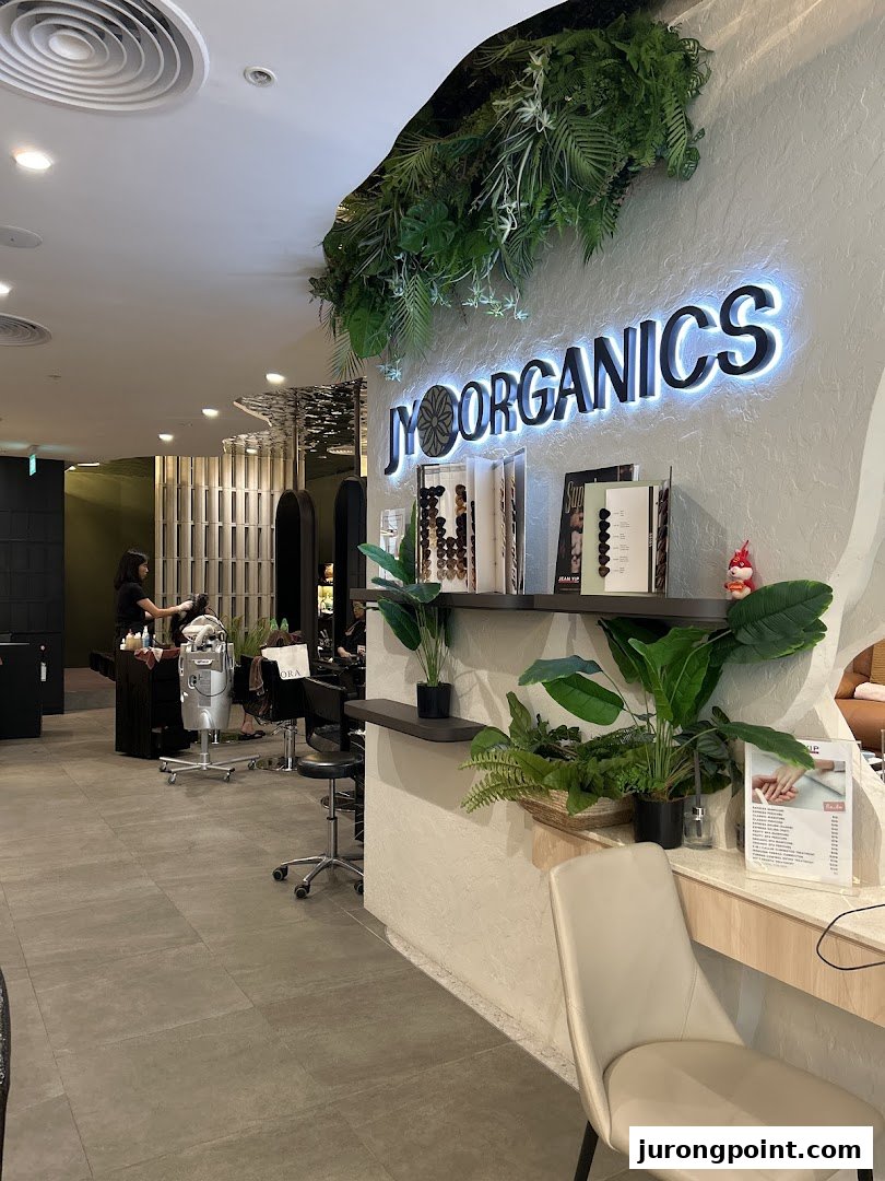 Interior view of Jean Yip Hairdressing salon, showcasing styling stations and the 'JY Organics' section.