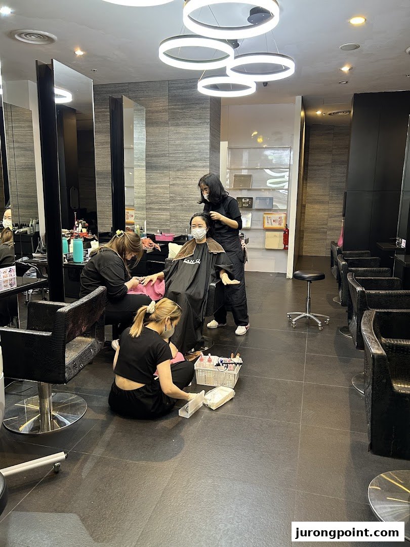 Interior view of Jean Yip Hairdressing salon with customers receiving hair and beauty services.