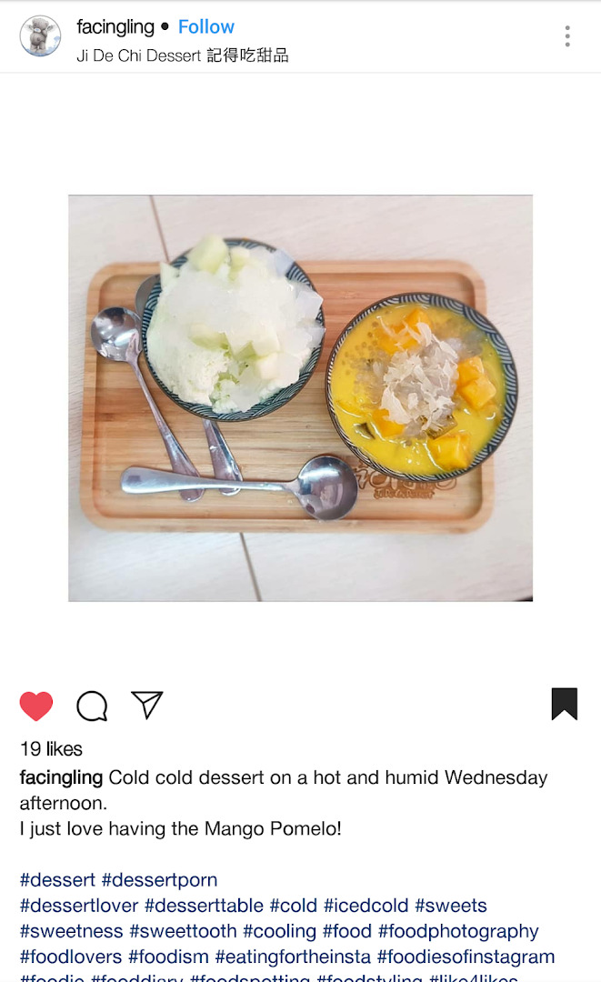 Two bowls of refreshing desserts, including mango pomelo sago, served on a wooden tray.