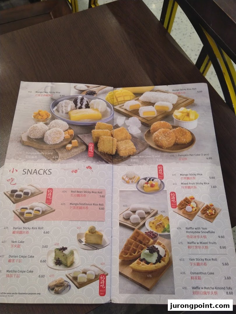 A detailed view of Ji De Chi Dessert's menu, showcasing various traditional Asian desserts and snacks.