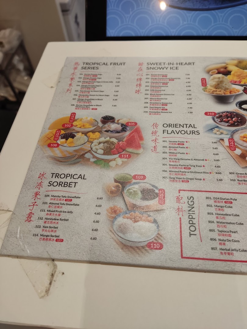 A detailed menu displaying various Asian desserts, including snowy ice, sorbets, and traditional pastes.