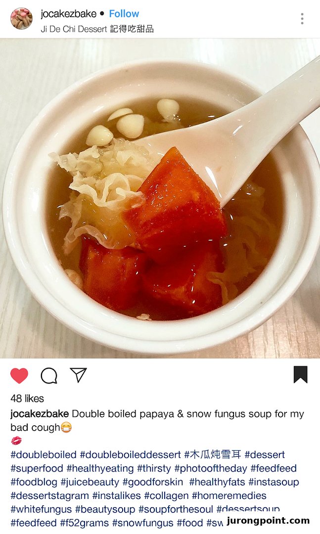 A close-up of a delicious double-boiled papaya and snow fungus dessert soup in a white bowl.