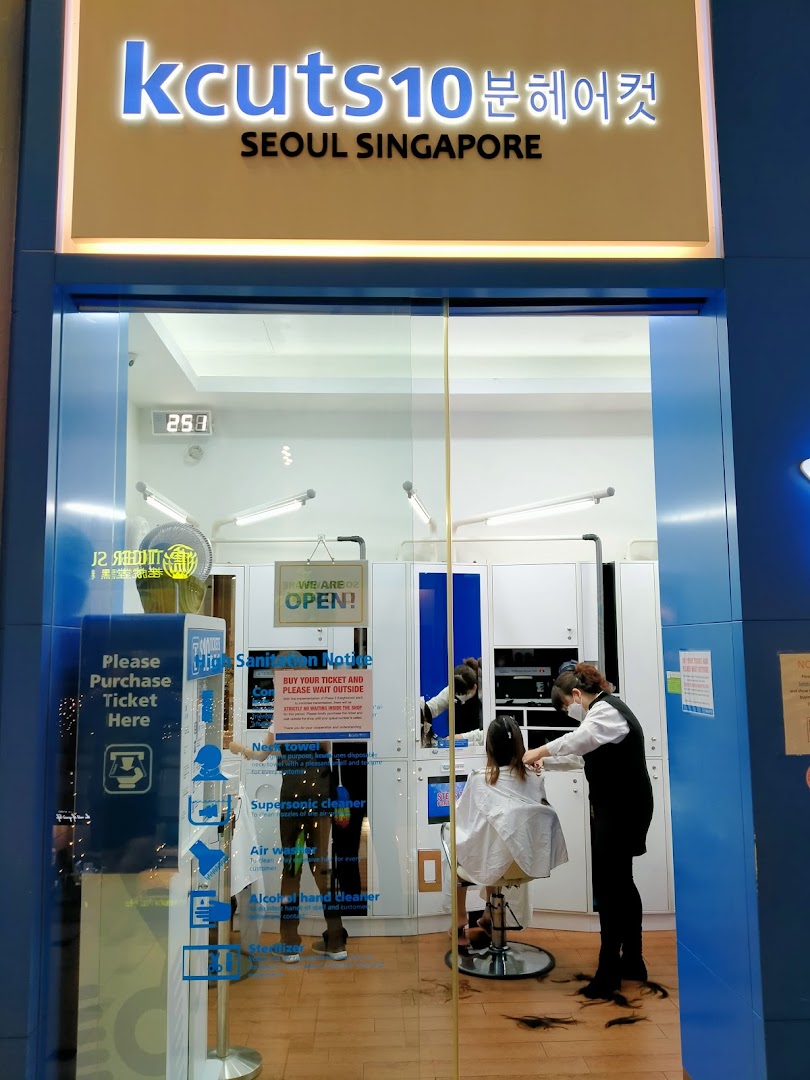 The kcuts shopfront shows a stylist cutting hair inside, highlighting its quick service.