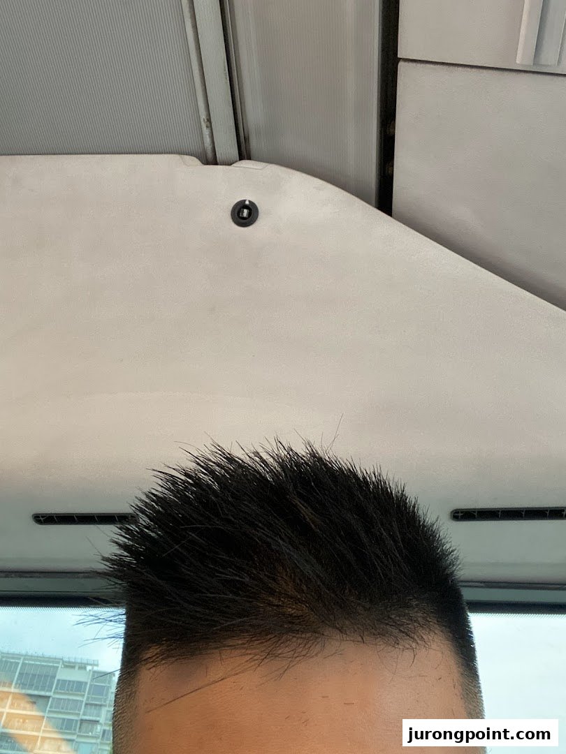 Close-up of a customer's spiky haircut, likely taken inside the kcuts salon.