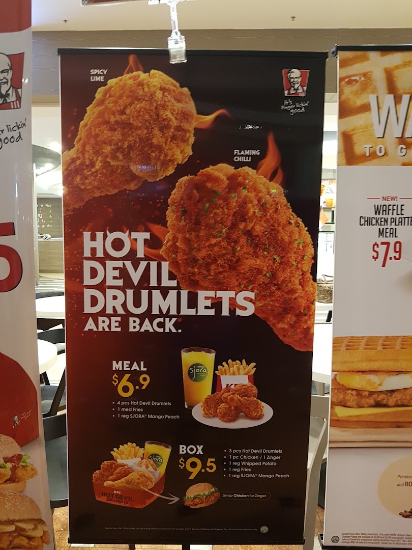 A promotional banner showcasing KFC's Hot Devil Drumlets and Waffle Chicken Platter Meal.