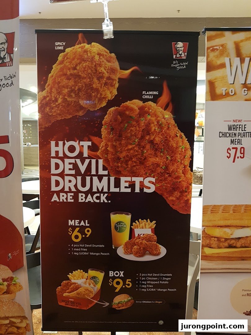 A promotional banner showcasing KFC's Hot Devil Drumlets and Waffle Chicken Platter Meal.