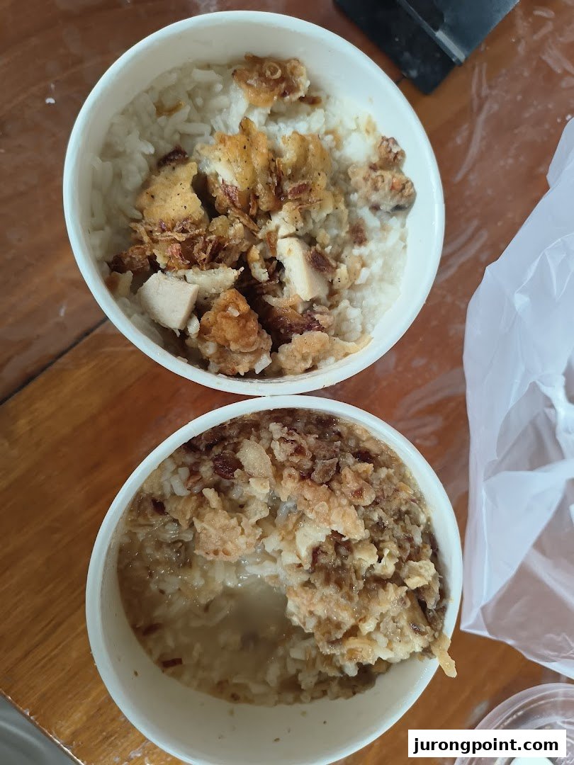 Two bowls of KFC rice with fried chicken pieces, ready to be enjoyed.