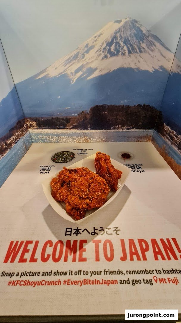 KFC's special fried chicken displayed against a scenic Mt. Fuji backdrop, inviting customers to 'Welcome to Japan!'.