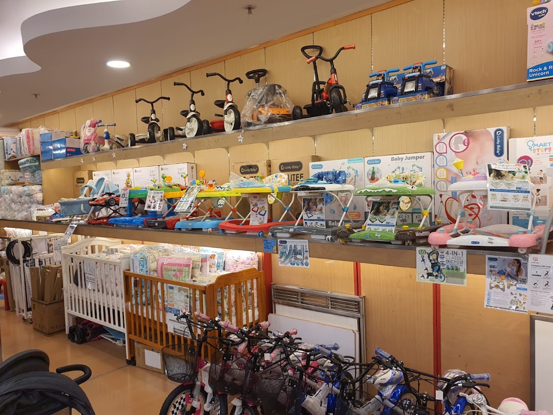 An interior view of Kiddy Palace showcasing baby gear, toys, and nursery furniture.
