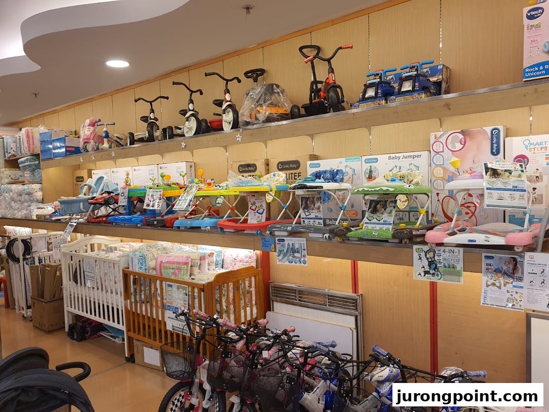 An interior view of Kiddy Palace showcasing baby gear, toys, and nursery furniture.