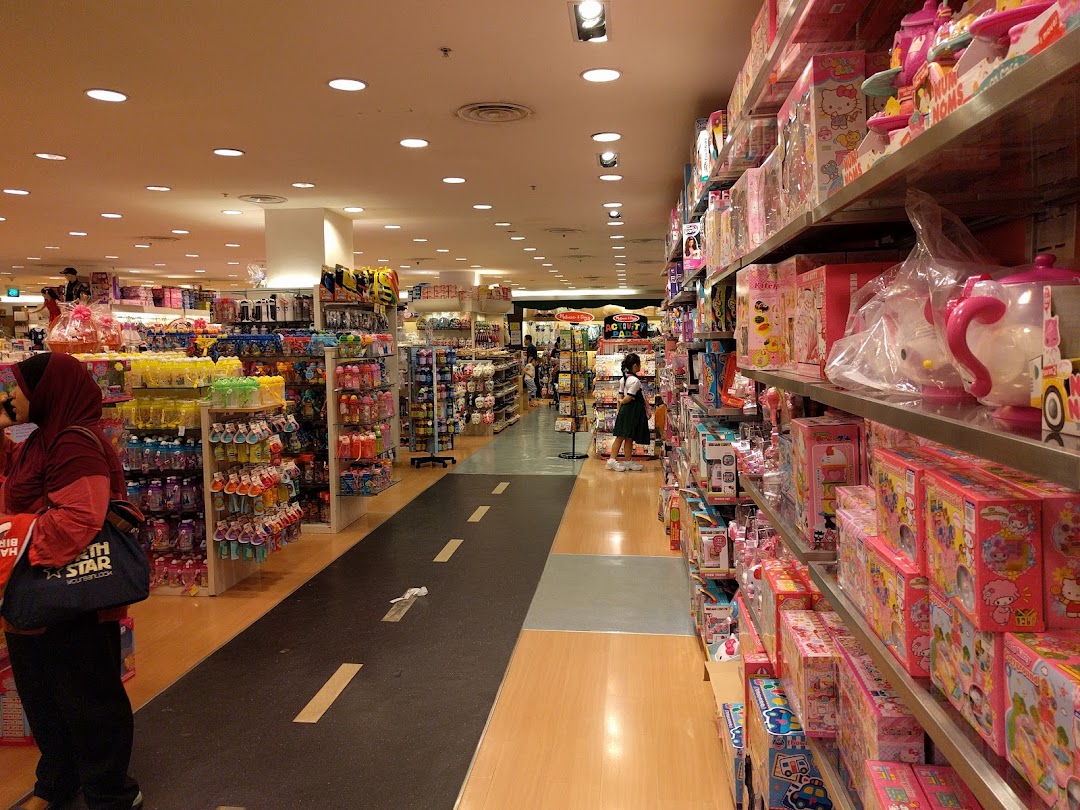 Spacious interior of Kiddy Palace, showcasing aisles of toys and children's products.