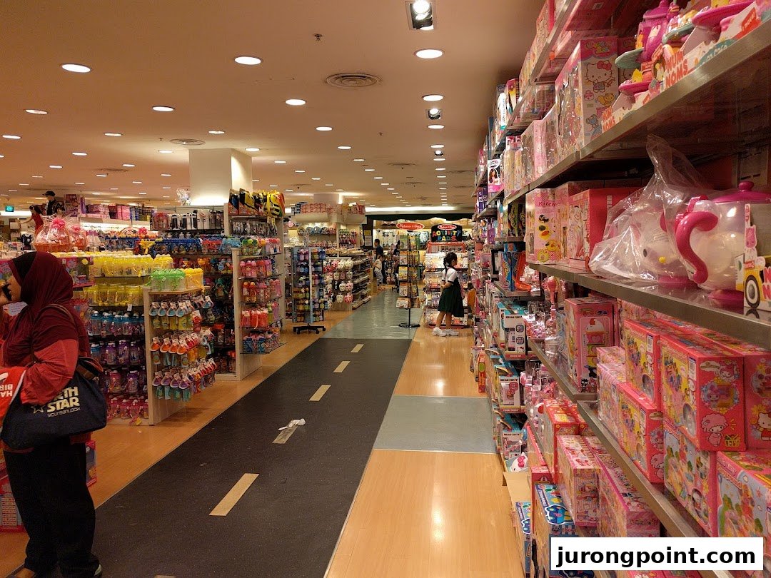 Spacious interior of Kiddy Palace, showcasing aisles of toys and children's products.
