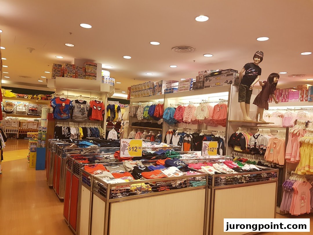Interior view of Kiddy Palace showcasing children's apparel, toys, and accessories.