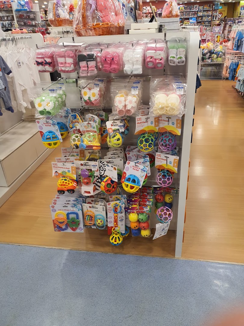 A display of colorful baby toys, rattles, and infant footwear at Kiddy Palace.