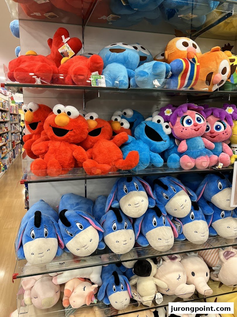 Shelves filled with colorful character plush toys, including Elmo, Cookie Monster, and Eeyore.