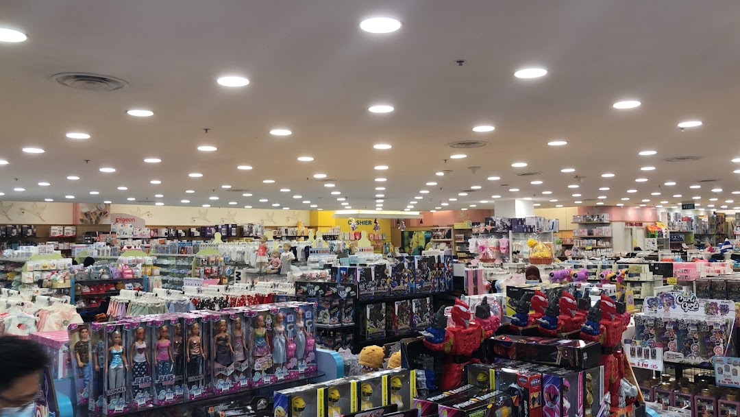 An expansive interior view of Kiddy Palace, showcasing aisles filled with toys, baby products, and children's apparel.