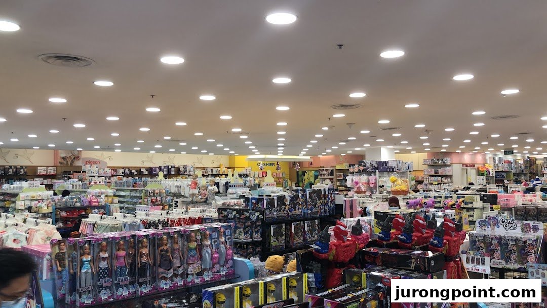 An expansive interior view of Kiddy Palace, showcasing aisles filled with toys, baby products, and children's apparel.