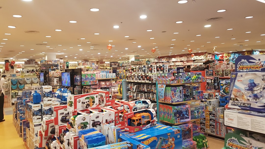 An expansive interior view of Kiddy Palace, showcasing numerous aisles filled with toys and children's products.