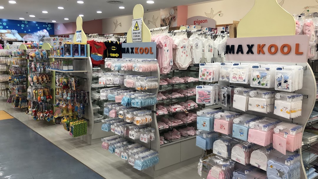 An interior view of Kiddy Palace, showcasing a wide array of baby clothing, accessories, and toys.