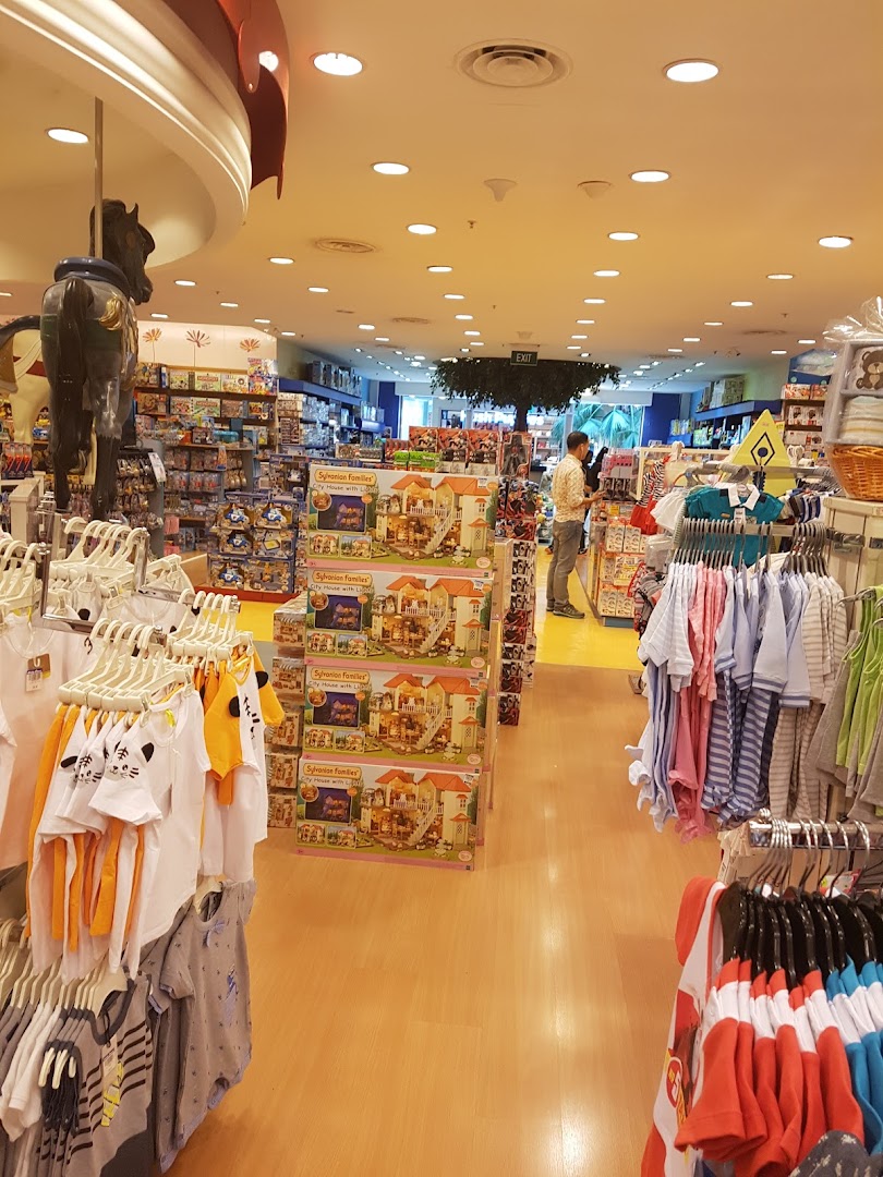 Vibrant interior of Kiddy Palace, showcasing children's apparel, Sylvanian Families toys, and a carousel horse.
