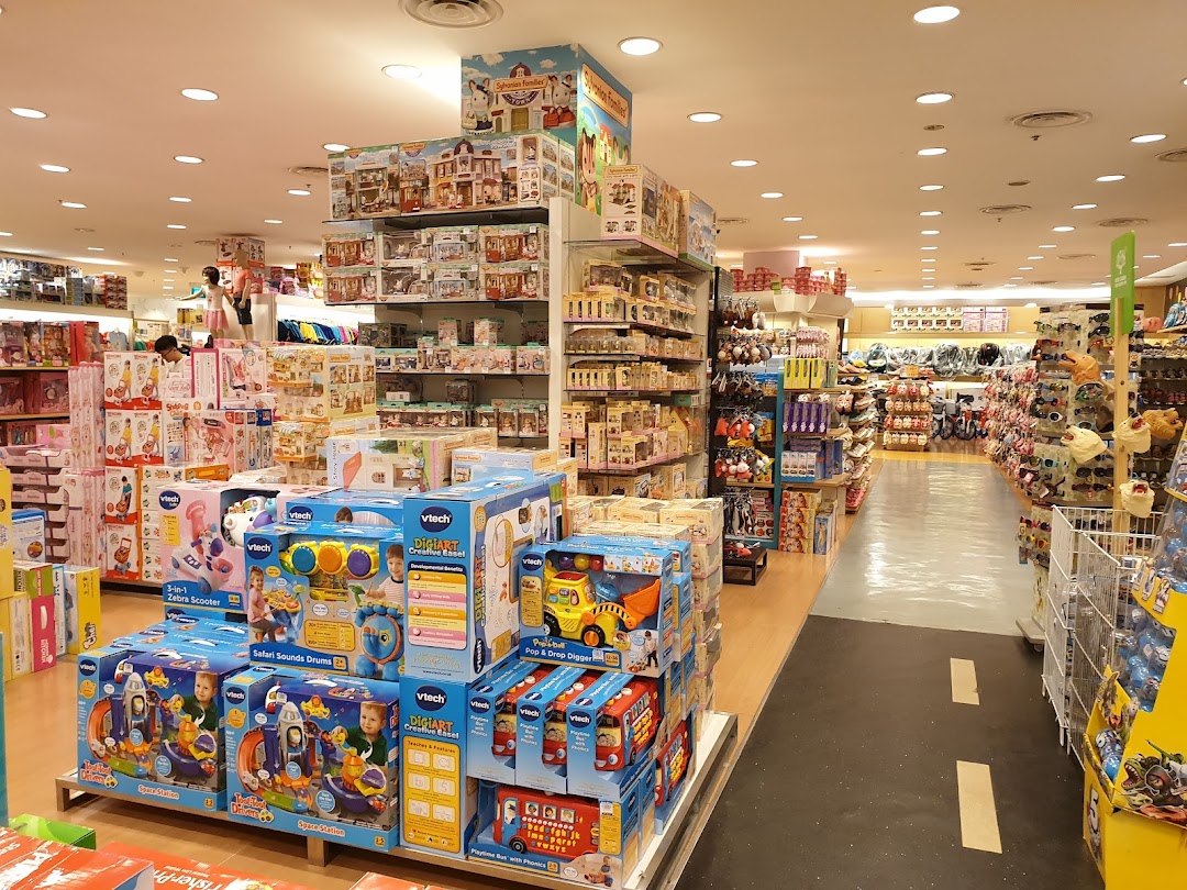 An aisle inside Kiddy Palace, showcasing a wide array of boxed toys, educational games, and children's products.
