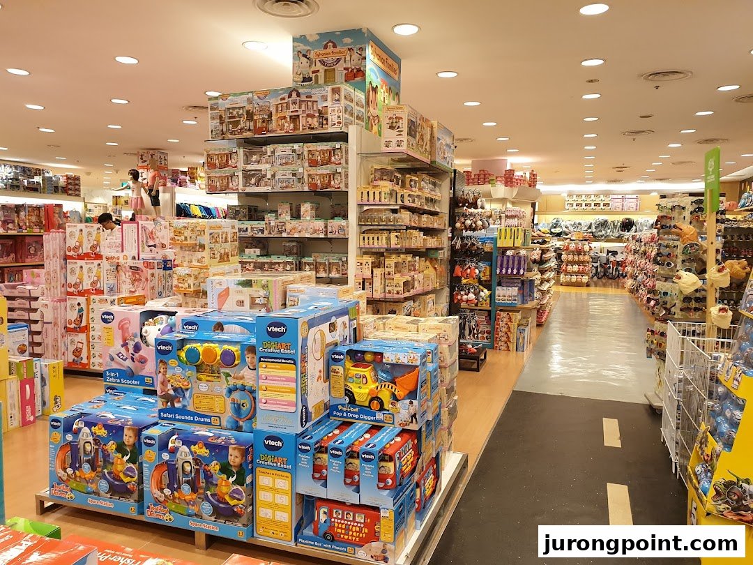 An aisle inside Kiddy Palace, showcasing a wide array of boxed toys, educational games, and children's products.