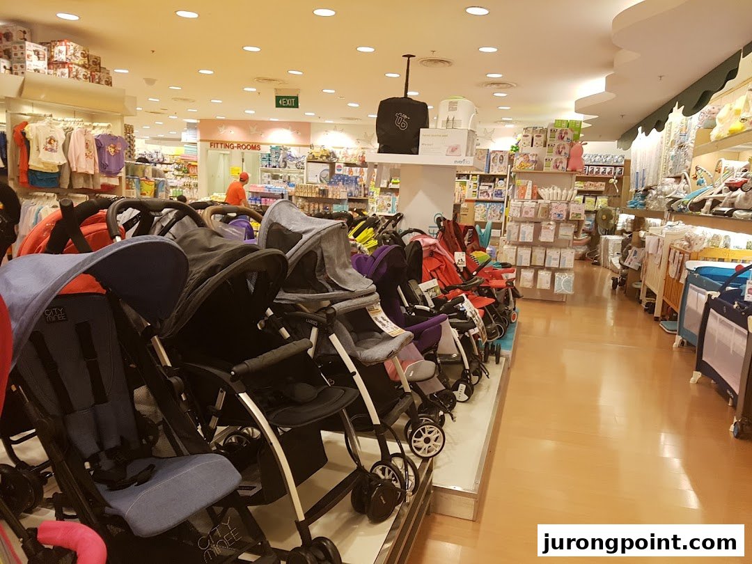 Interior view of Kiddy Palace showcasing a wide selection of strollers and various baby products.