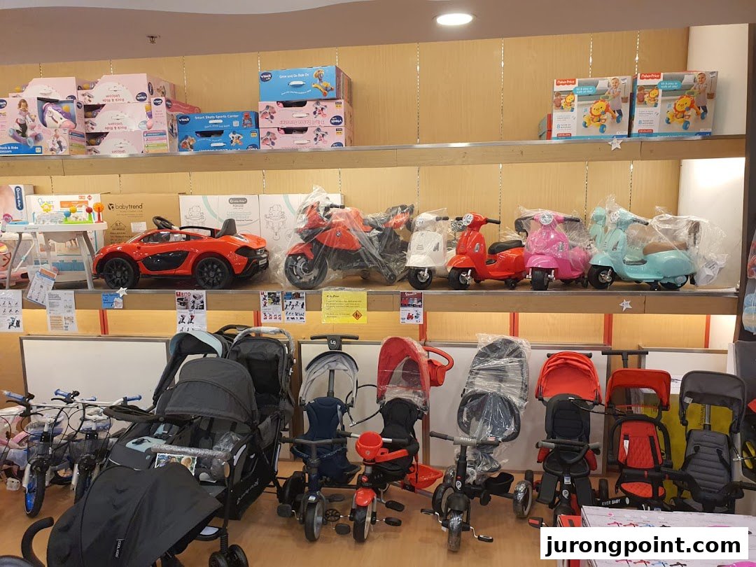 An interior shot of Kiddy Palace showcasing children's strollers, ride-on toys, and baby gear.