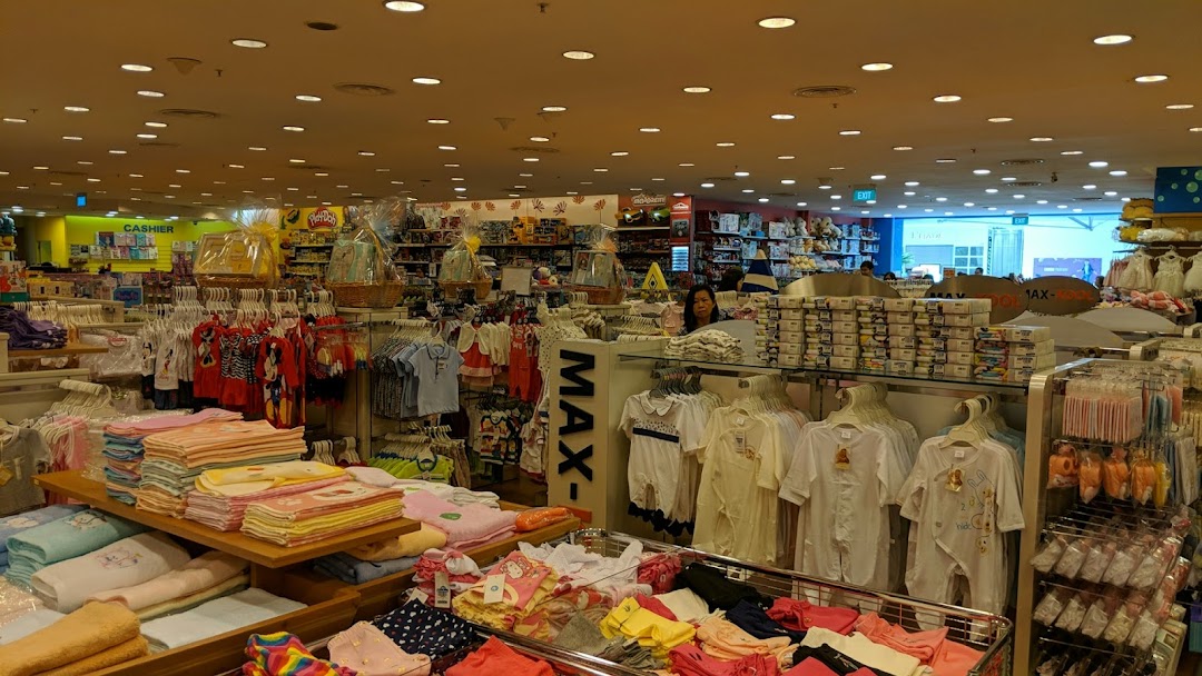 Interior view of Kiddy Palace, showcasing a wide array of baby clothing, toys, and children's essentials.