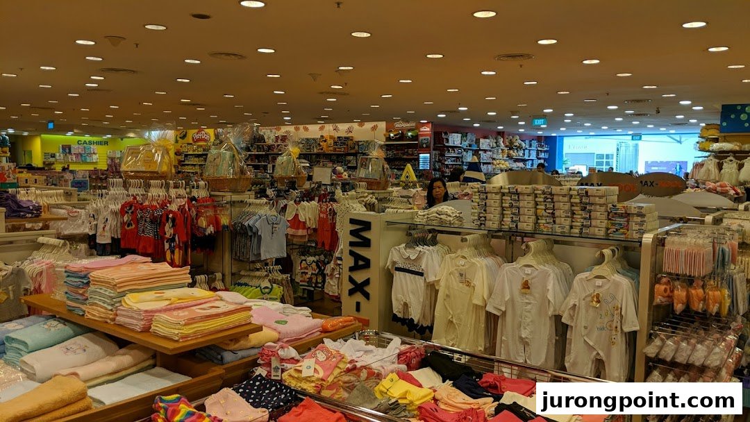 Interior view of Kiddy Palace, showcasing a wide array of baby clothing, toys, and children's essentials.