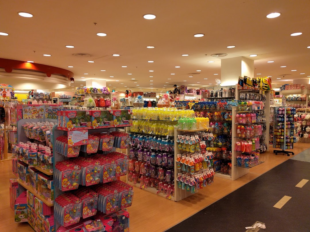 An interior view of Kiddy Palace, showcasing aisles filled with children's toys and baby products.