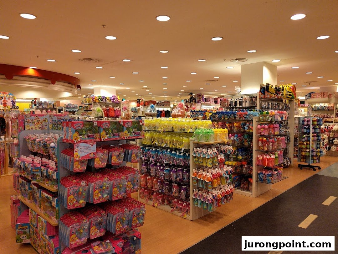 An interior view of Kiddy Palace, showcasing aisles filled with children's toys and baby products.