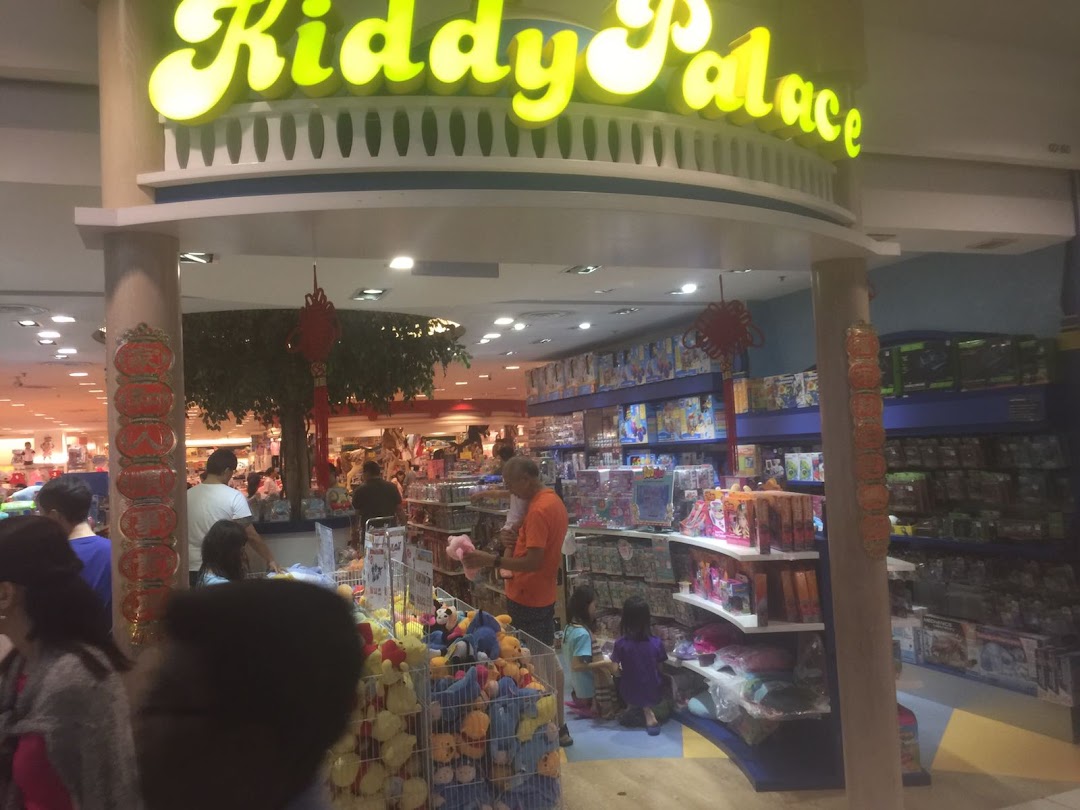 Entrance view of Kiddy Palace, a children's store, with customers browsing toys and products.