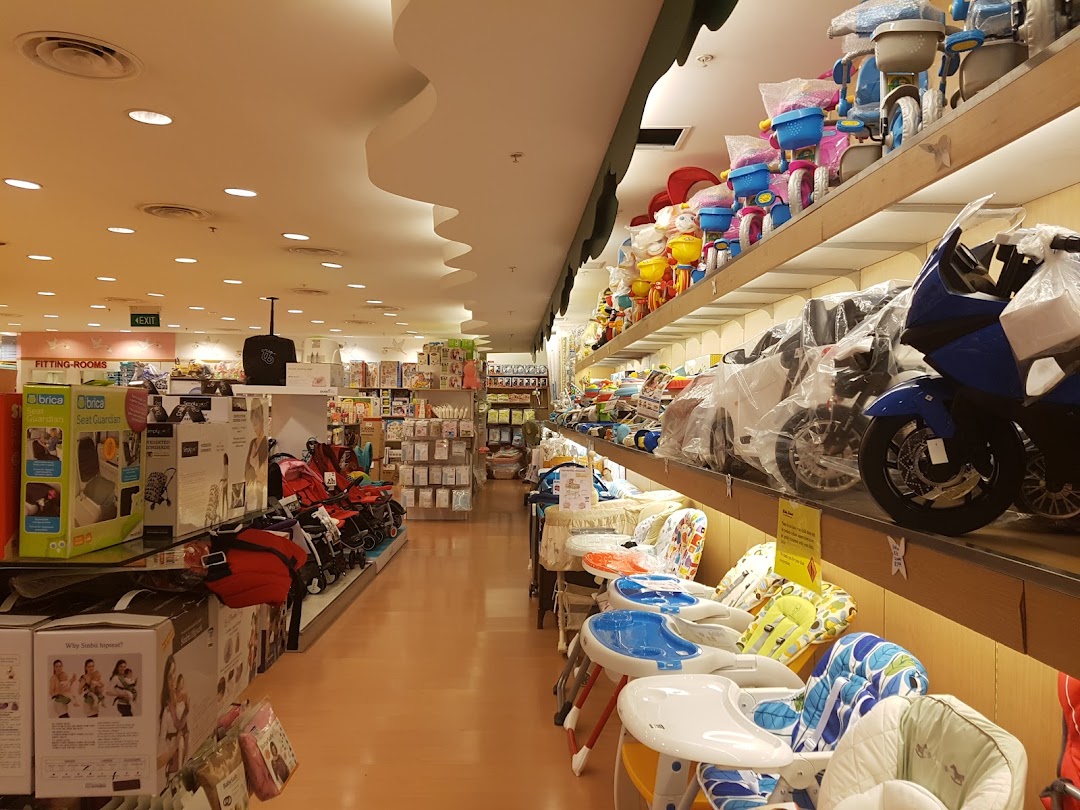 Interior view of Kiddy Palace, showcasing baby gear, strollers, high chairs, and ride-on toys.