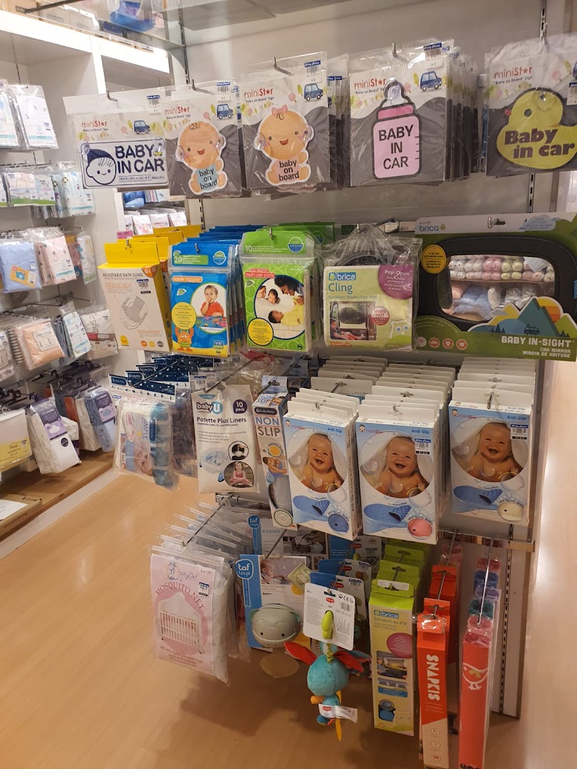 Interior view of Kiddy Palace showcasing a variety of baby essentials and accessories on display shelves.