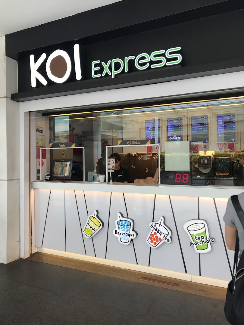The bright, modern shop front of KOI Express, a popular bubble tea establishment.