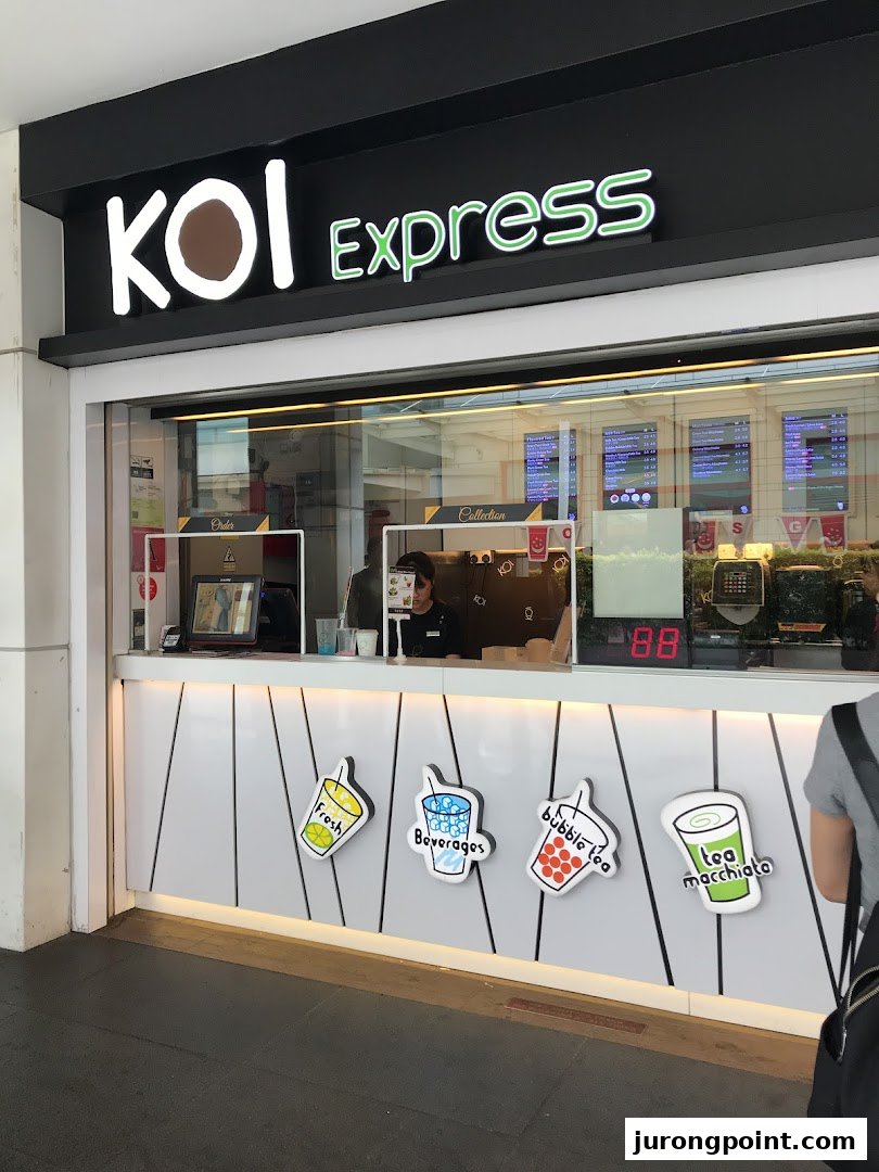 The bright, modern shop front of KOI Express, a popular bubble tea establishment.